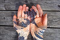 Photograph of tattooed hands with waves